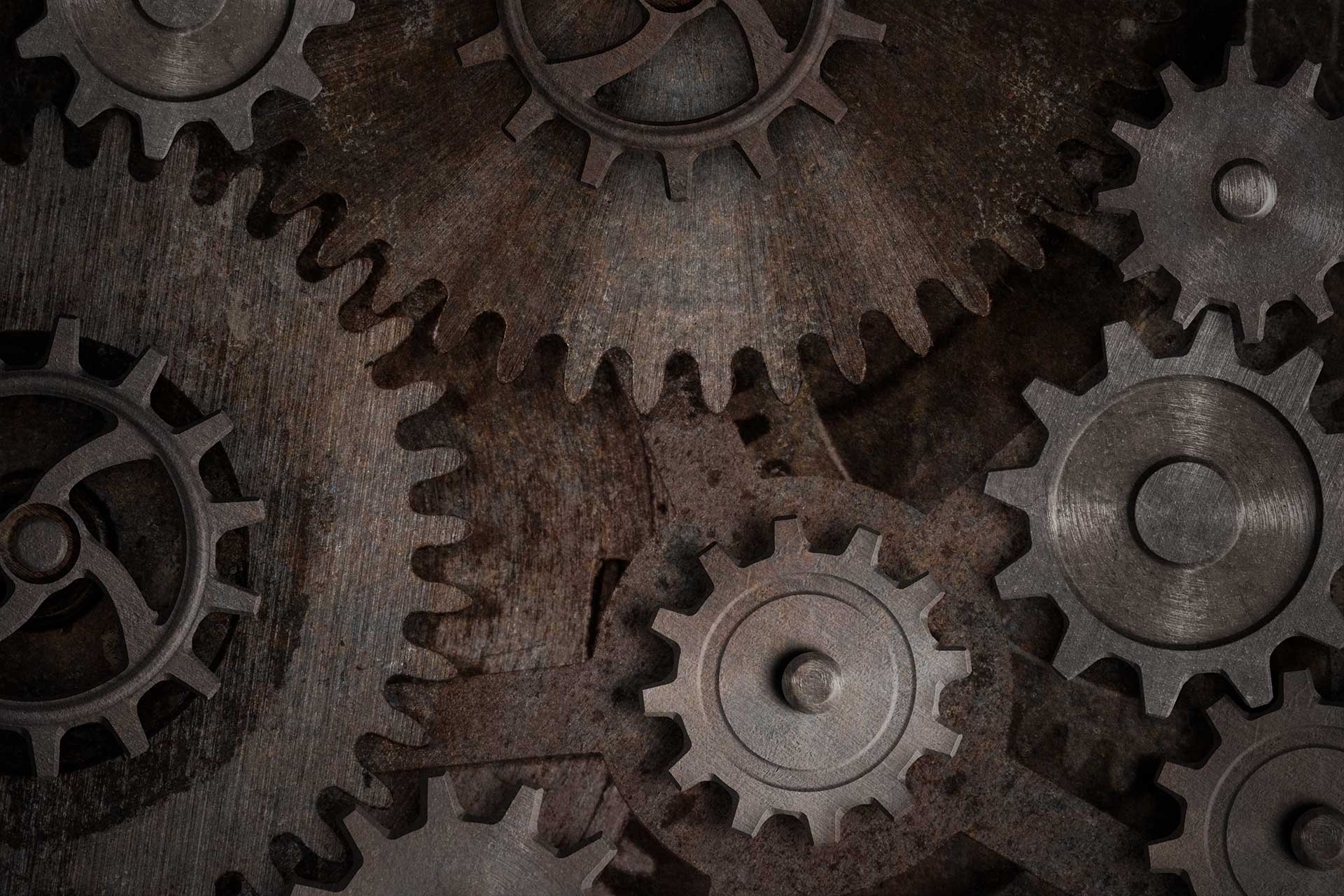 Close-up of interlocking rusted metal gears